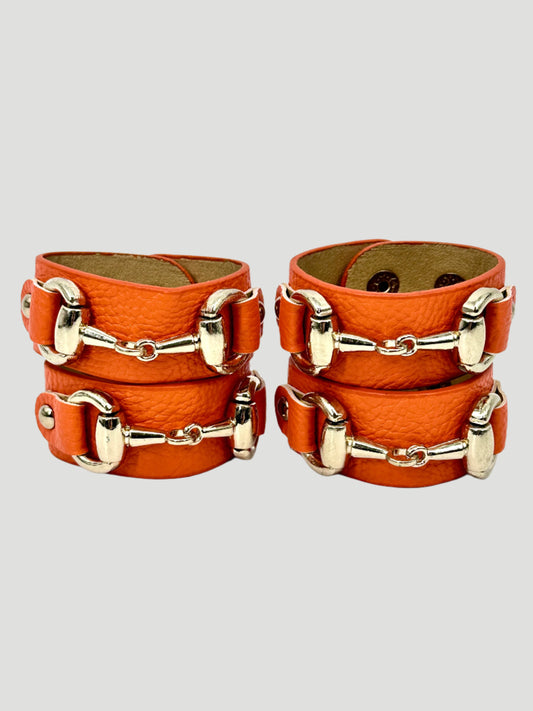 Set of 4 Orange Leather Napkin Rings With Horsebit Detail by Julian Mejia Design
