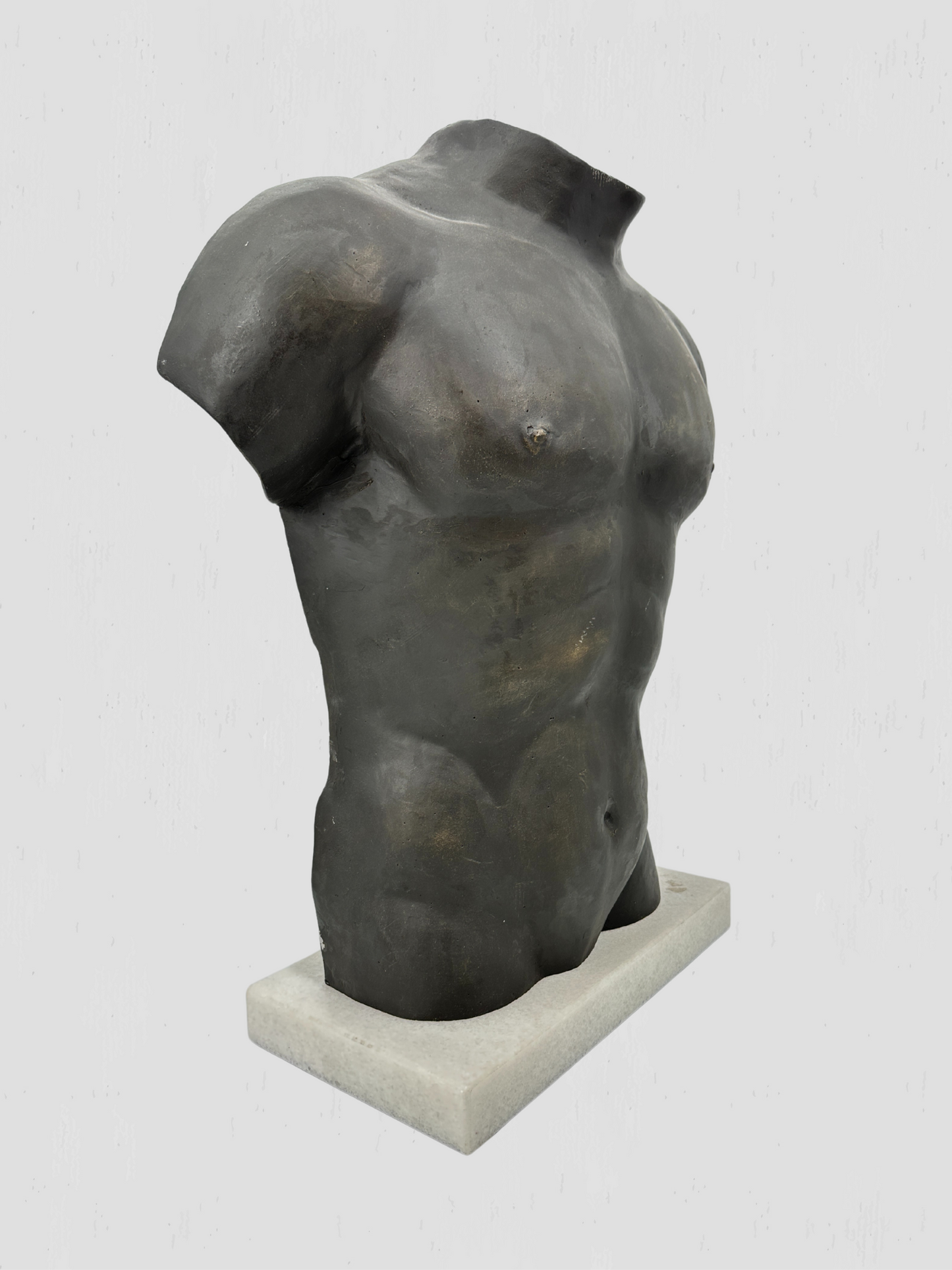 Black Metal Torso Sculpture on White Marble Base