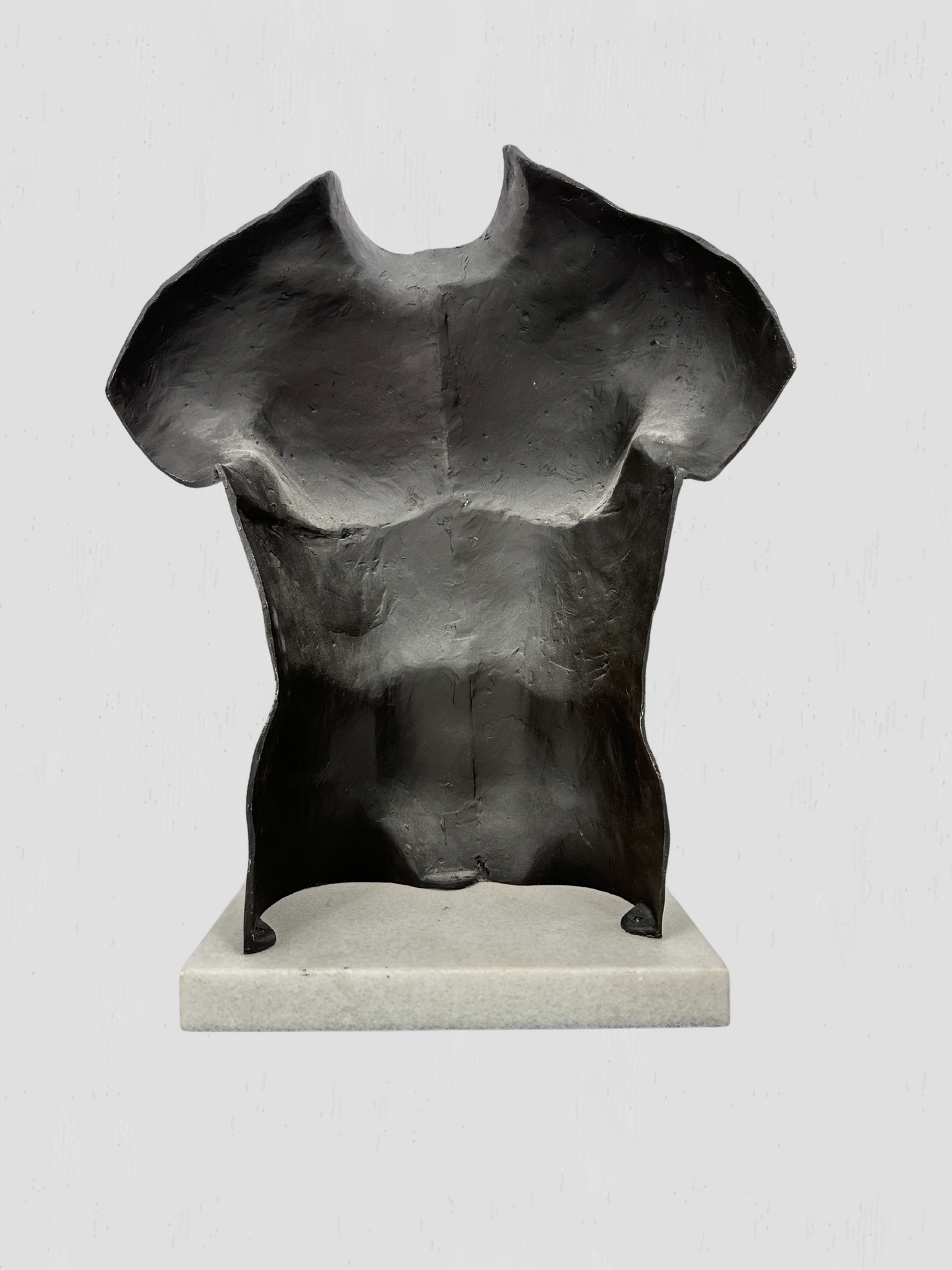 Black Metal Torso Sculpture on White Marble Base