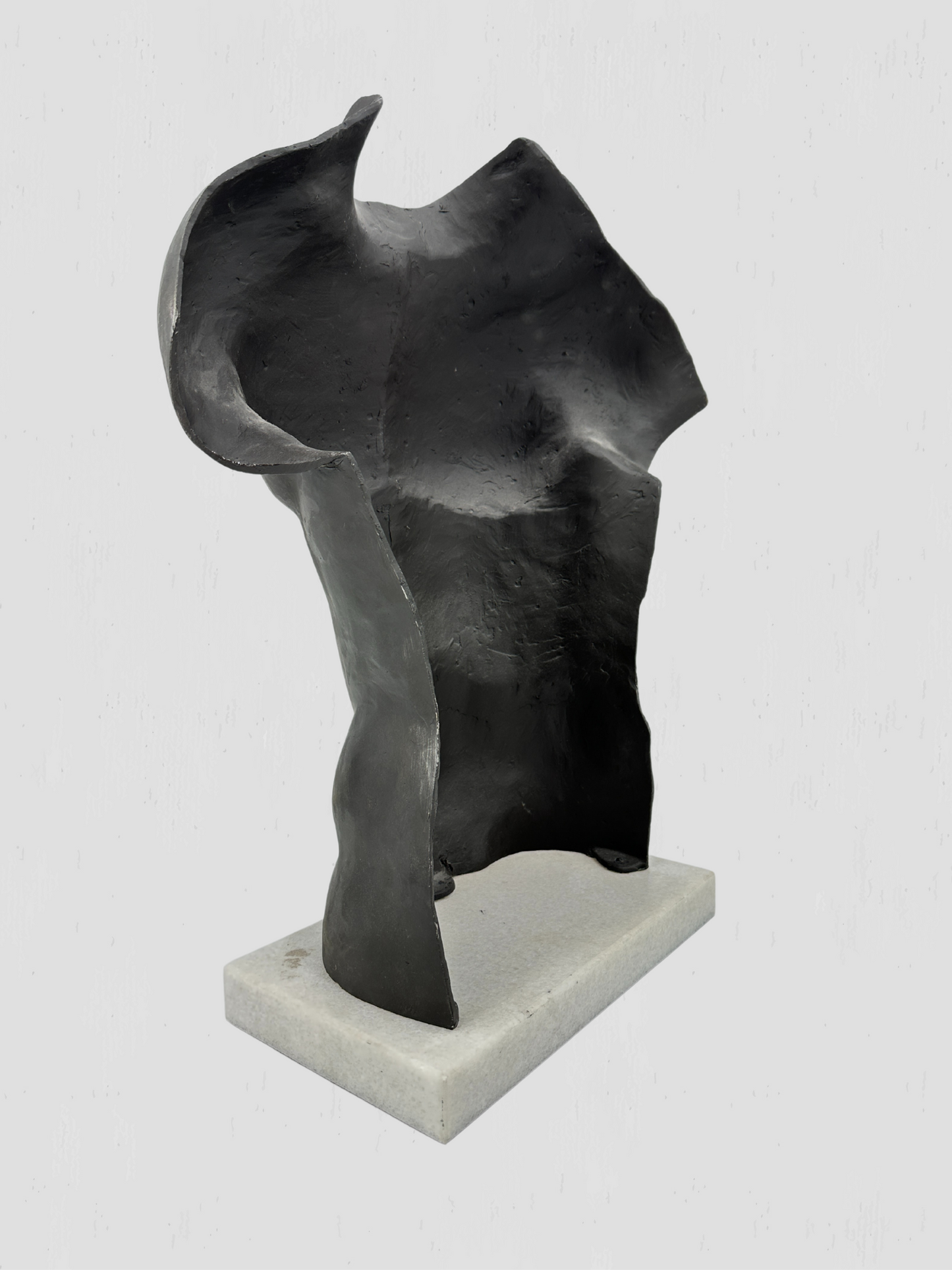 Black Metal Torso Sculpture on White Marble Base