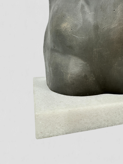 Black Metal Torso Sculpture on White Marble Base